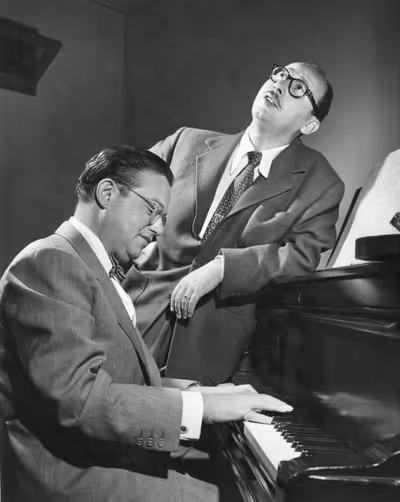 Jule Styne playing piano with Sammy singing.